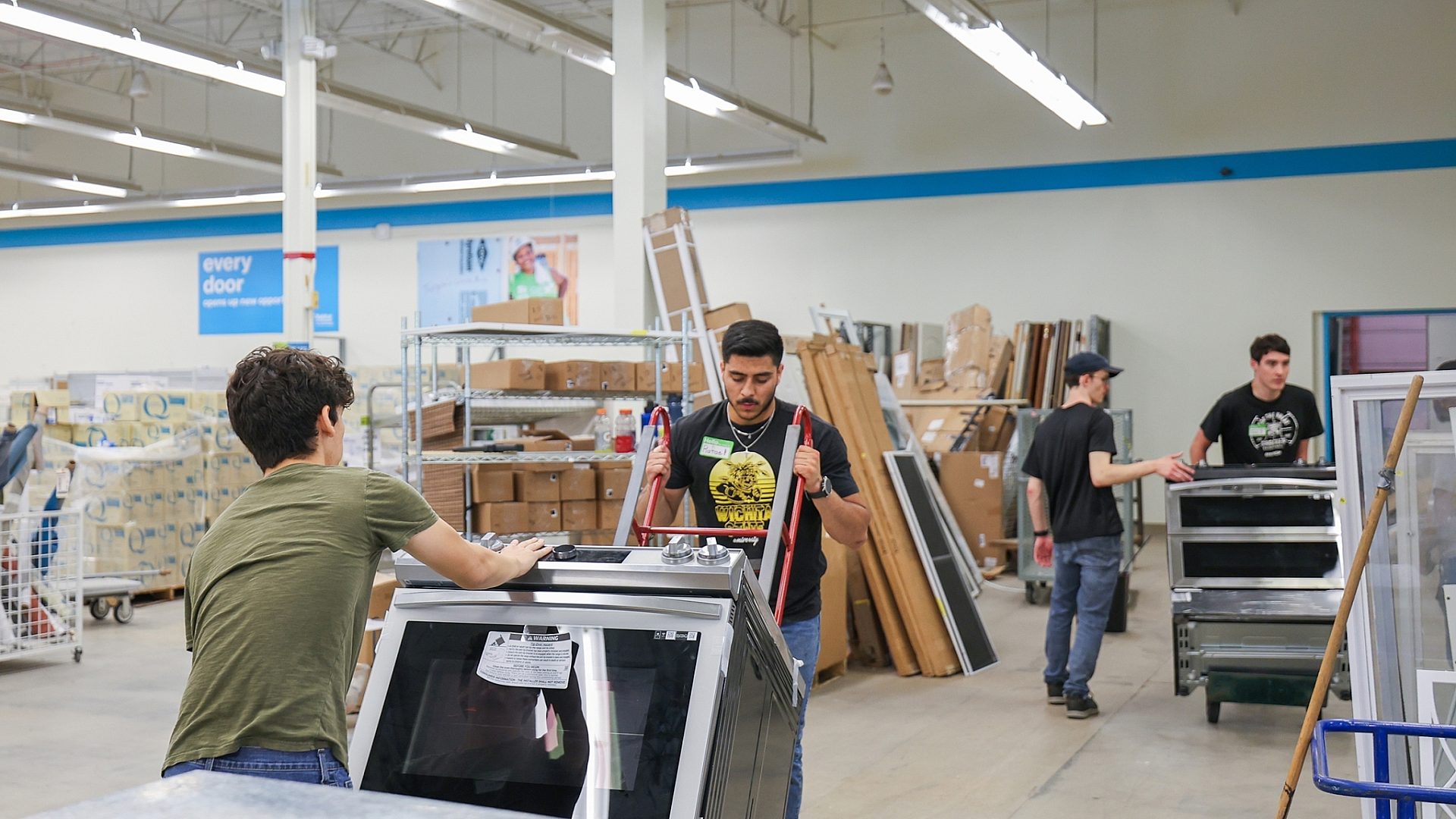 Re Store volunteers moving appliances