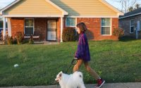 Girl walking dog